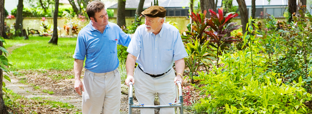 caregiver assisting the patient in walking