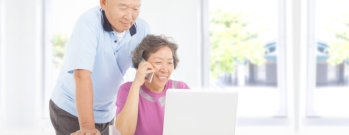 senior couple using gadgets